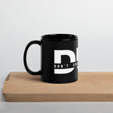 Don't Underestimate Him - Black Glossy Mug